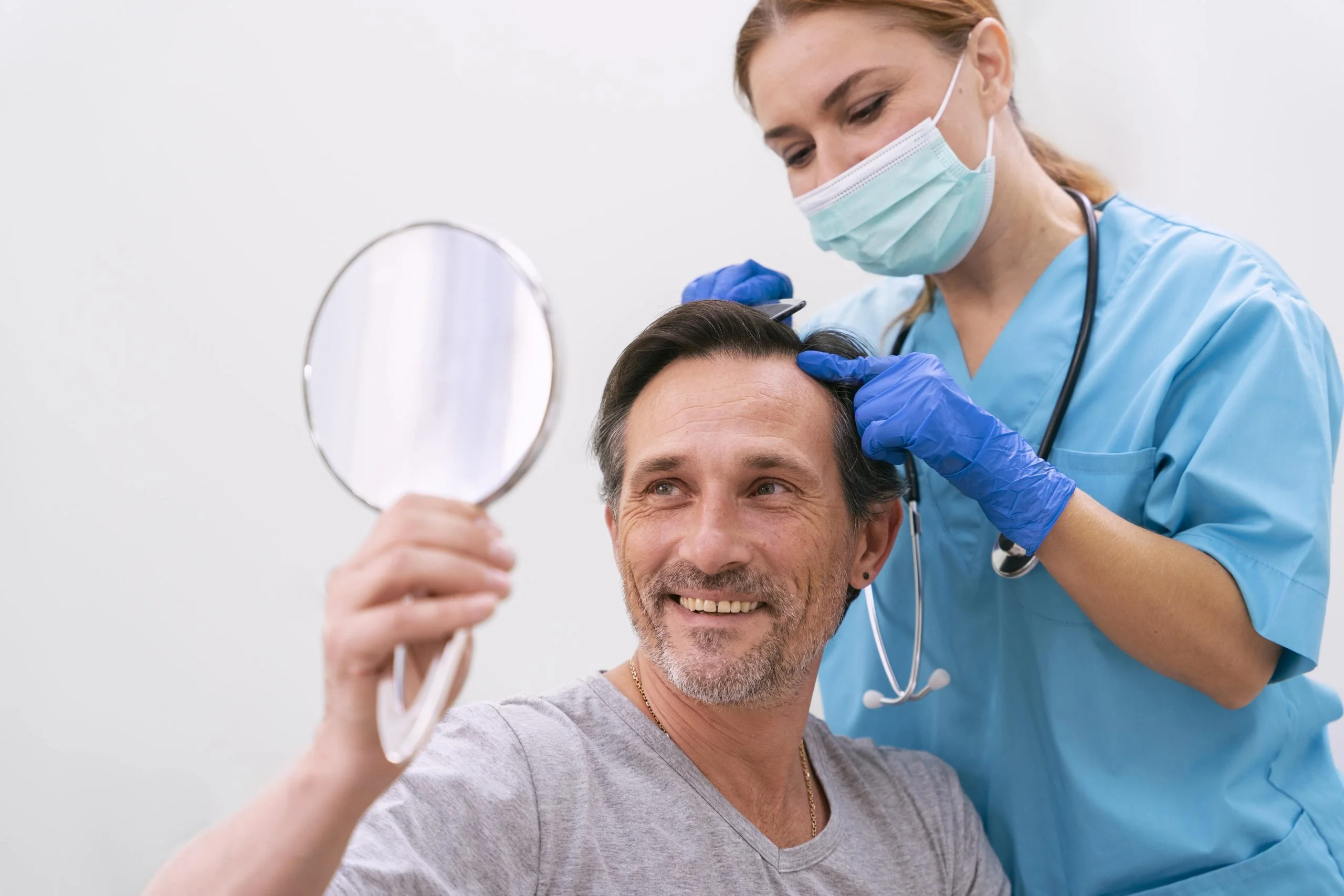 Man receiving hair loss treatment